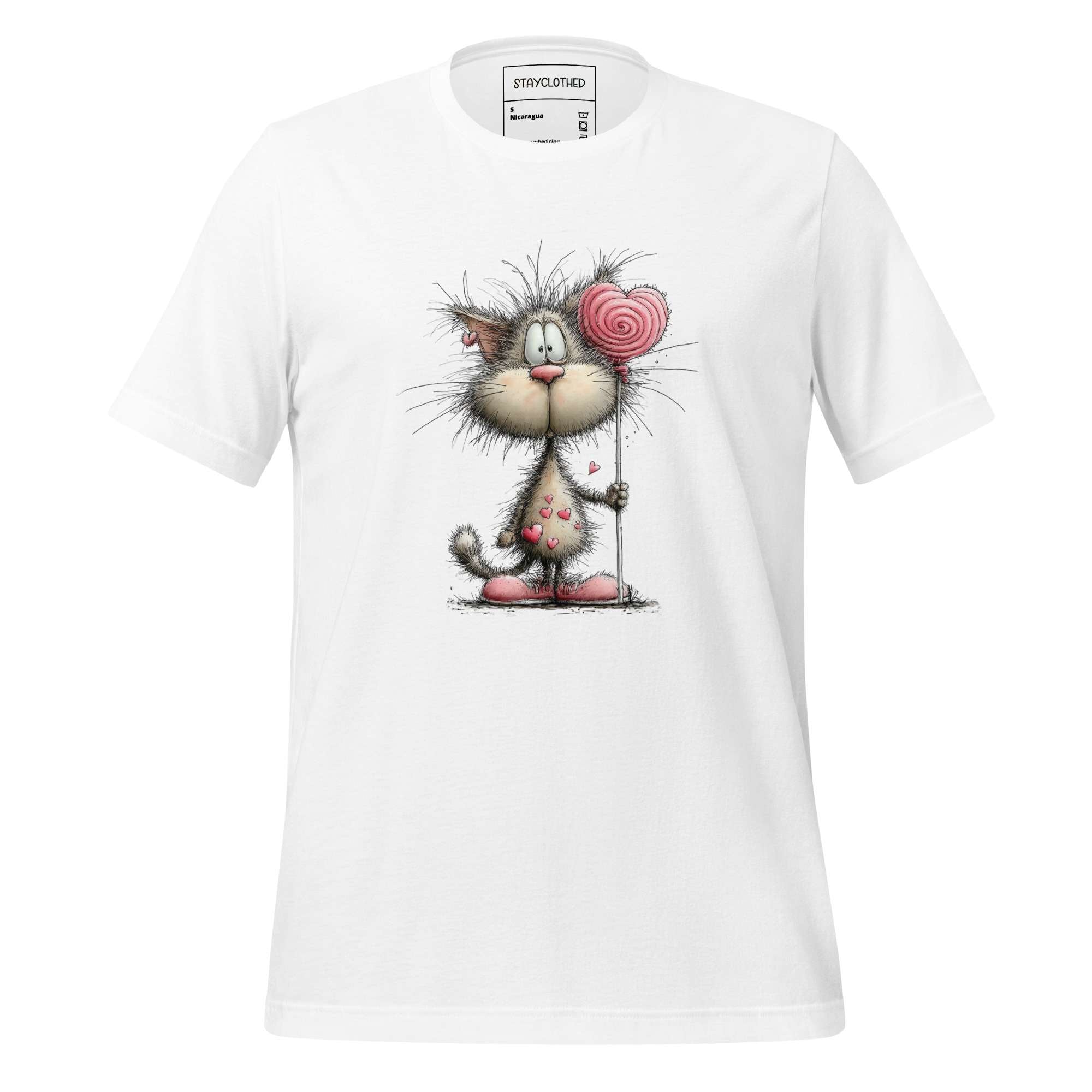 White t-shirt with a cartoon cat design on a wooden surface, featuring the brand 'StayClothed'.