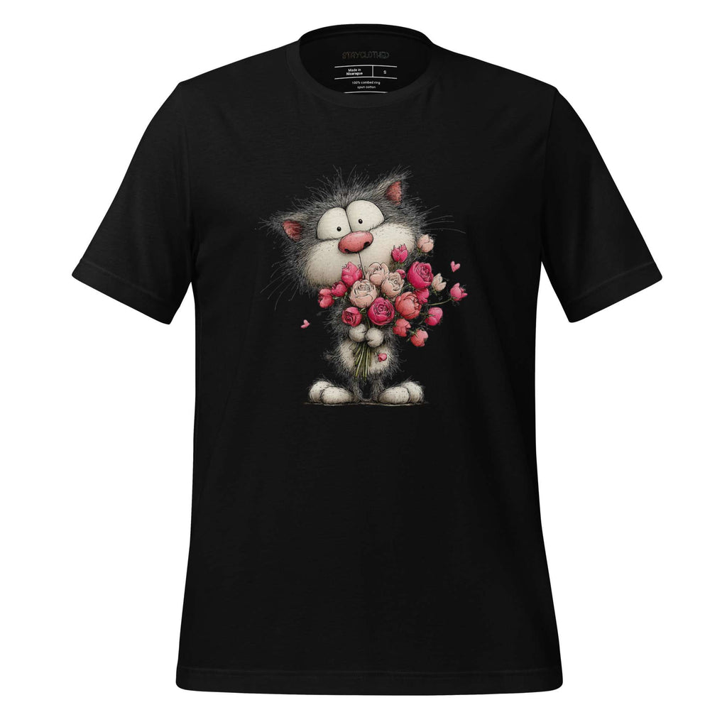 Black t-shirt with a cartoon cat holding flowers on a wooden surface, featuring the brand 'StayClothed'.