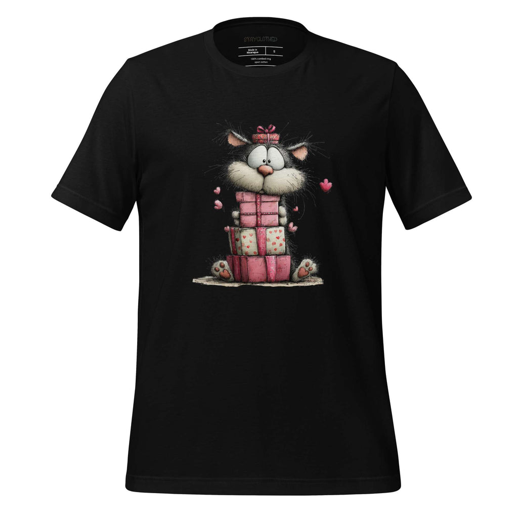 Black t-shirt with a cartoon cat design on a wooden surface, featuring the brand 'StayClothed'.