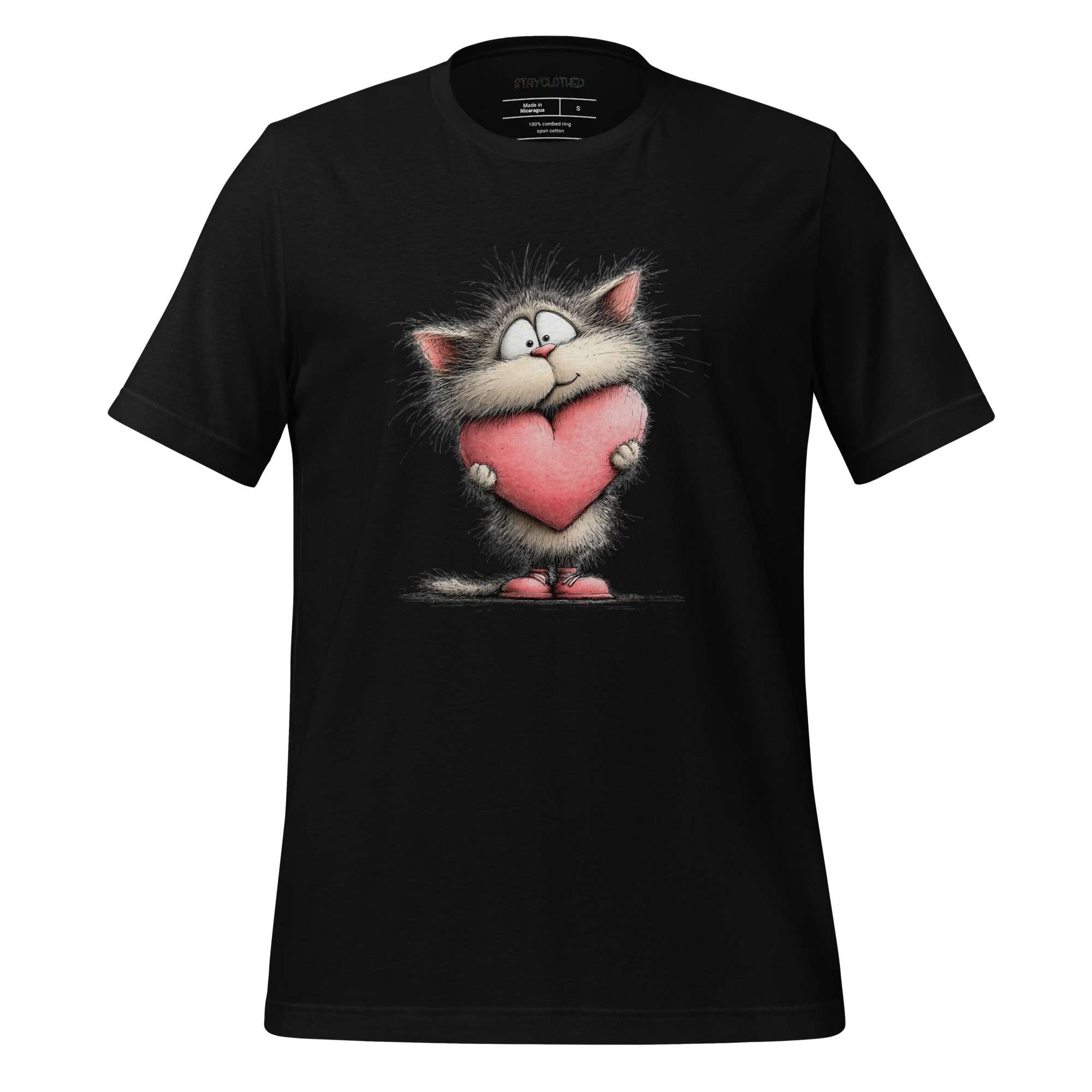 Black t-shirt with a cat holding a heart graphic on a wooden surface, featuring the brand 'StayClothed'.