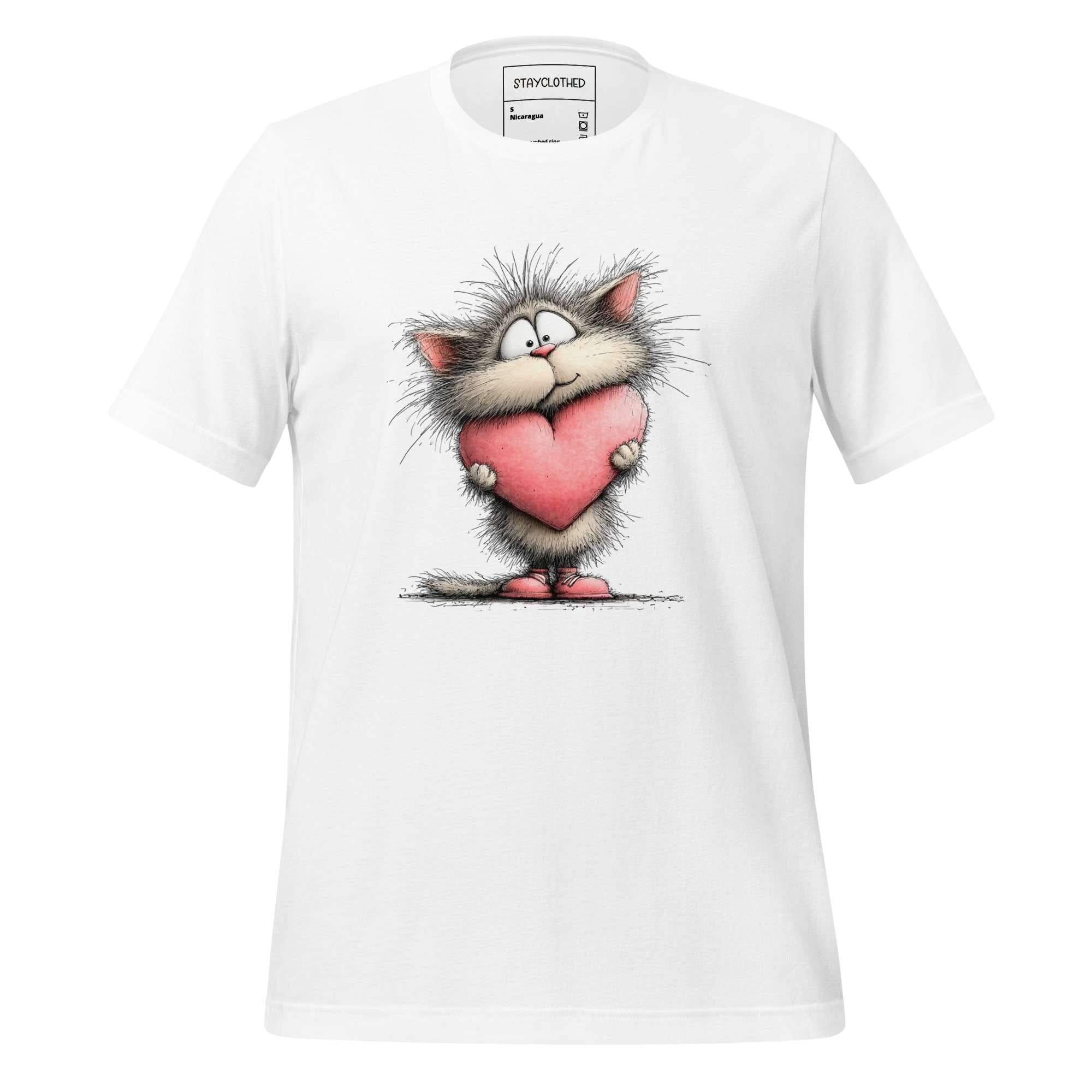 White t-shirt with cartoon cat holding a heart on a wooden surface, featuring 'StayClothed' brand.