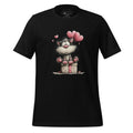 Black t-shirt with a cartoon cat design on a wooden surface, featuring the brand 'StayClothed'.