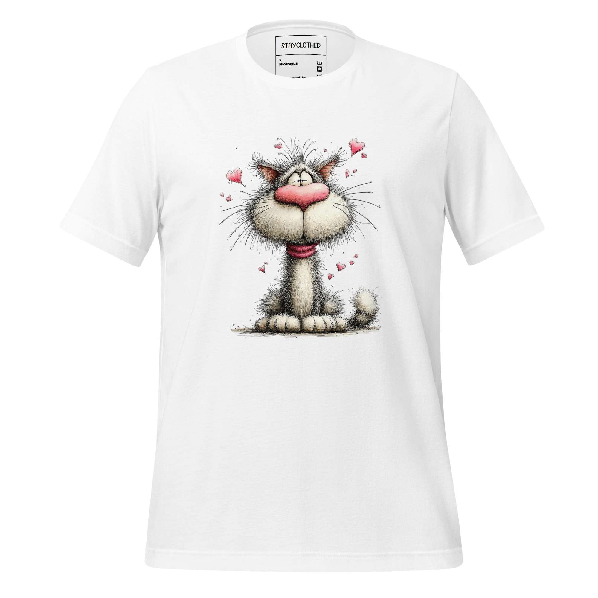 White t-shirt with a cartoon cat design on a wooden surface, featuring the brand 'StayClothed'.