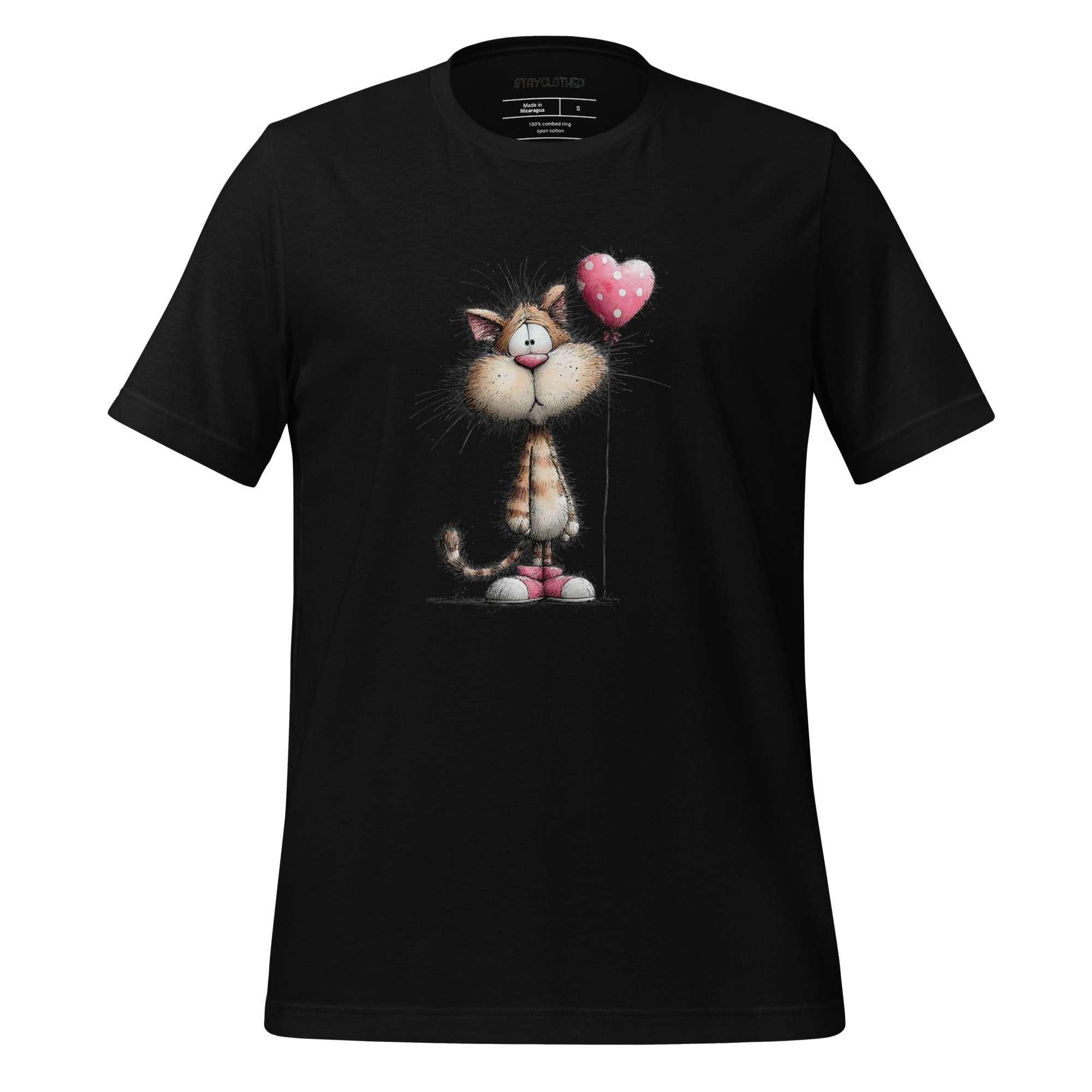 Black t-shirt with a cat holding a heart balloon design on a wooden surface, featuring the brand 'StayClothed'.