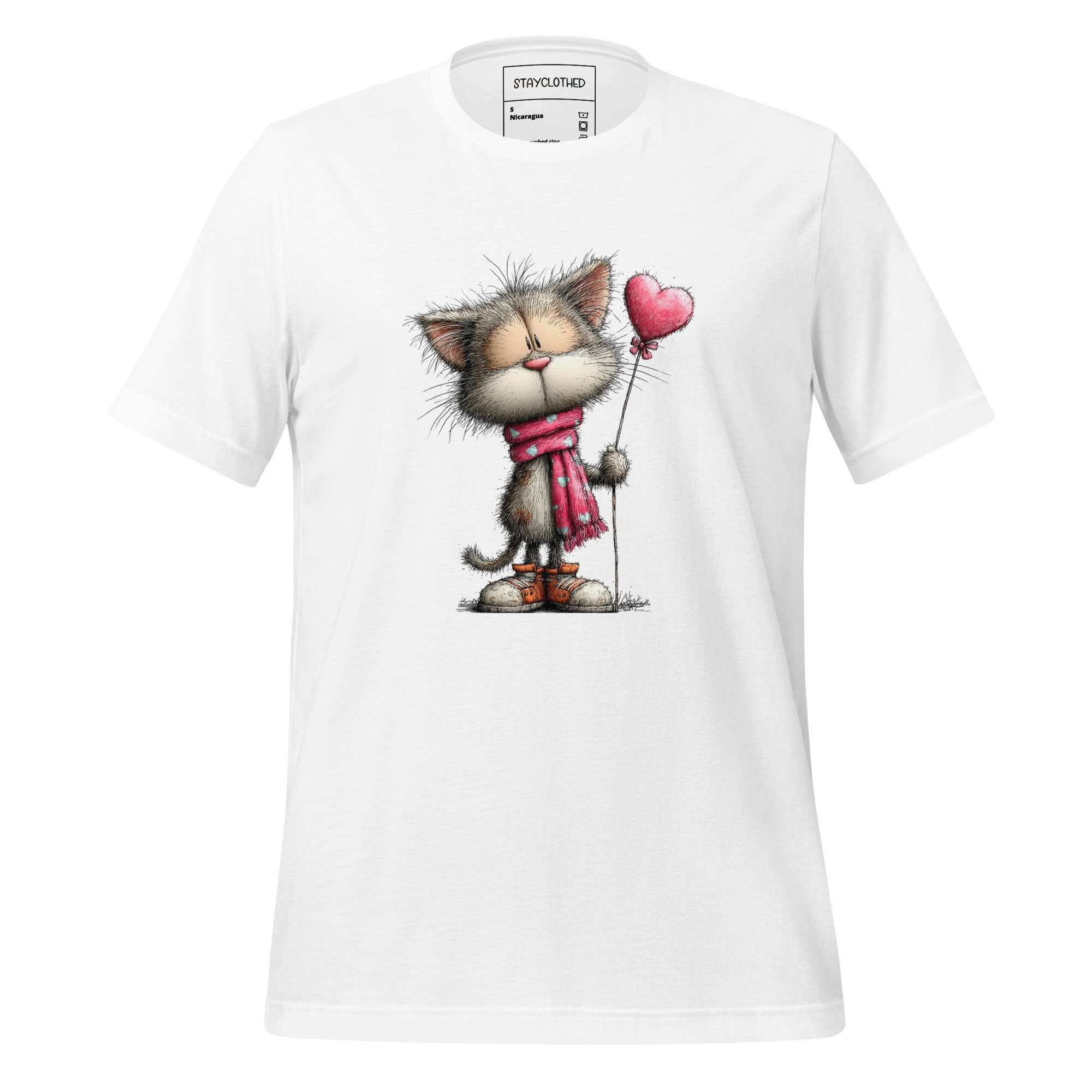 White t-shirt with a cat holding a heart-shaped balloon on a wooden surface, featuring the brand 'StayClothed'.