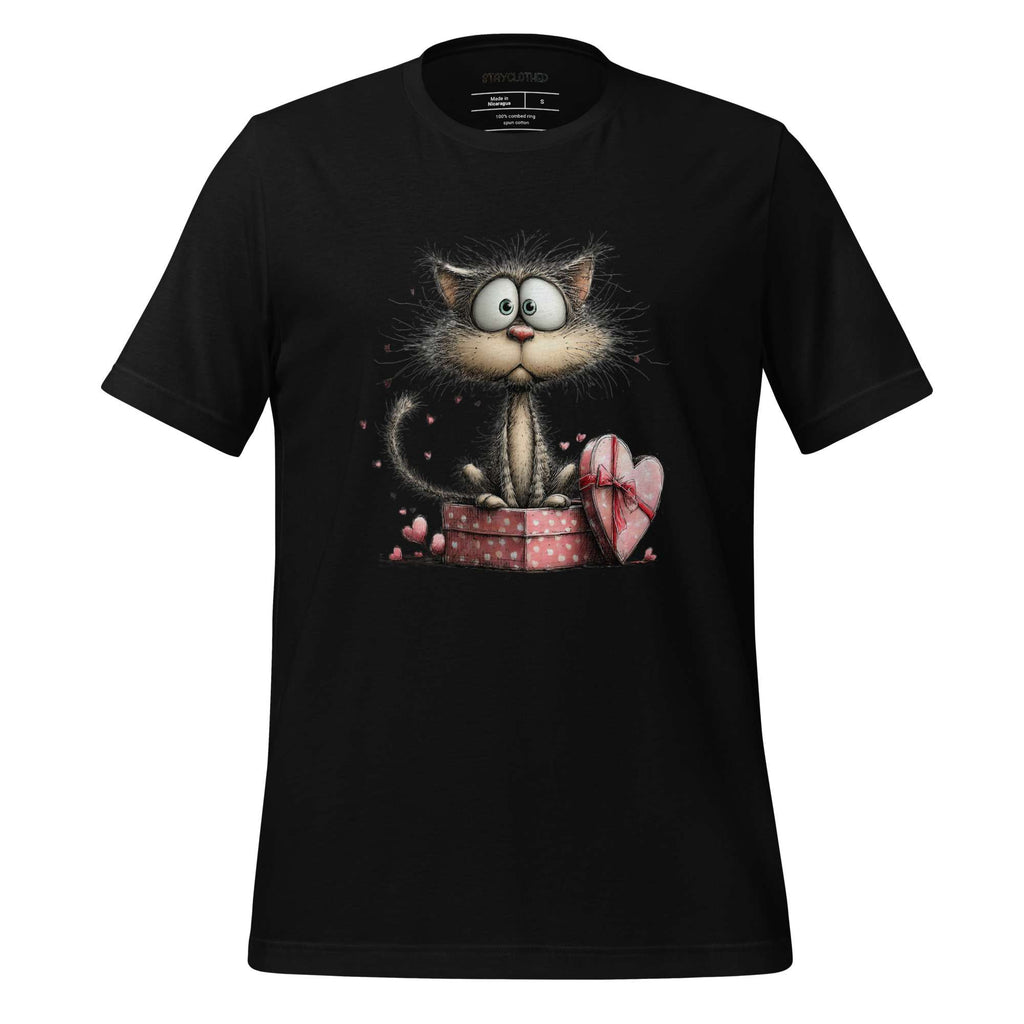 Black t-shirt with a cat graphic on a wooden surface, featuring the brand 'StayClothed'.