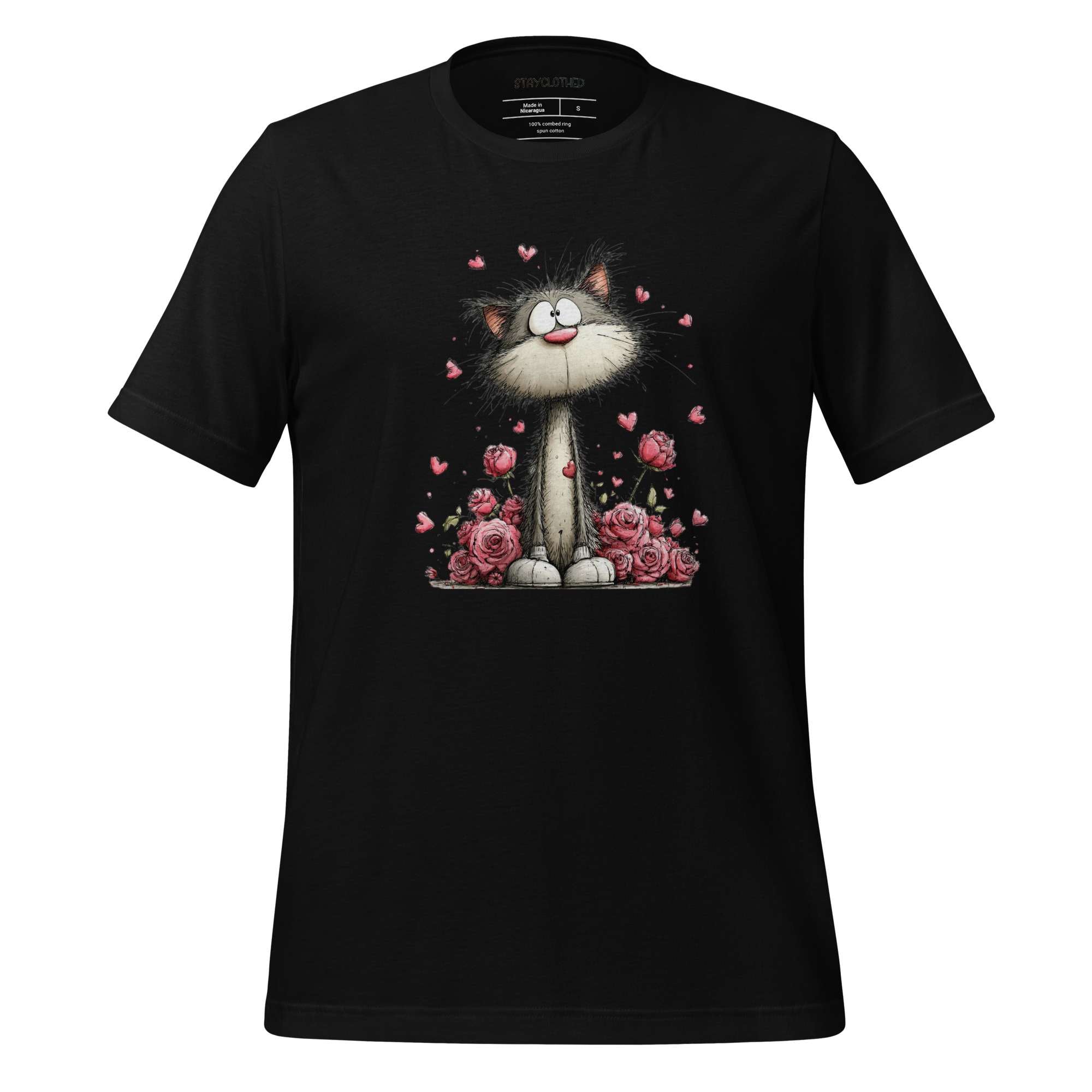 Black t-shirt with a cat and flower design on a wooden surface, featuring the brand 'StayClothed'.