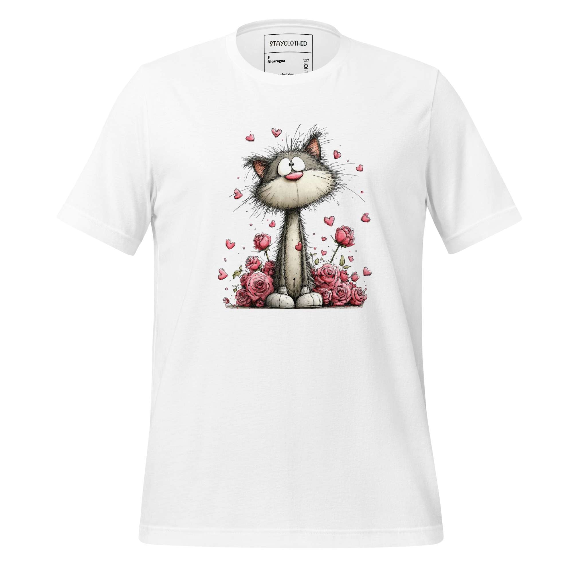 White t-shirt with a cat and flower design on a wooden surface, featuring the brand 'StayClothed'.