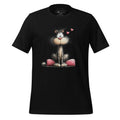 Black t-shirt with a cat graphic on a wooden surface, featuring the brand 'StayClothed'.
