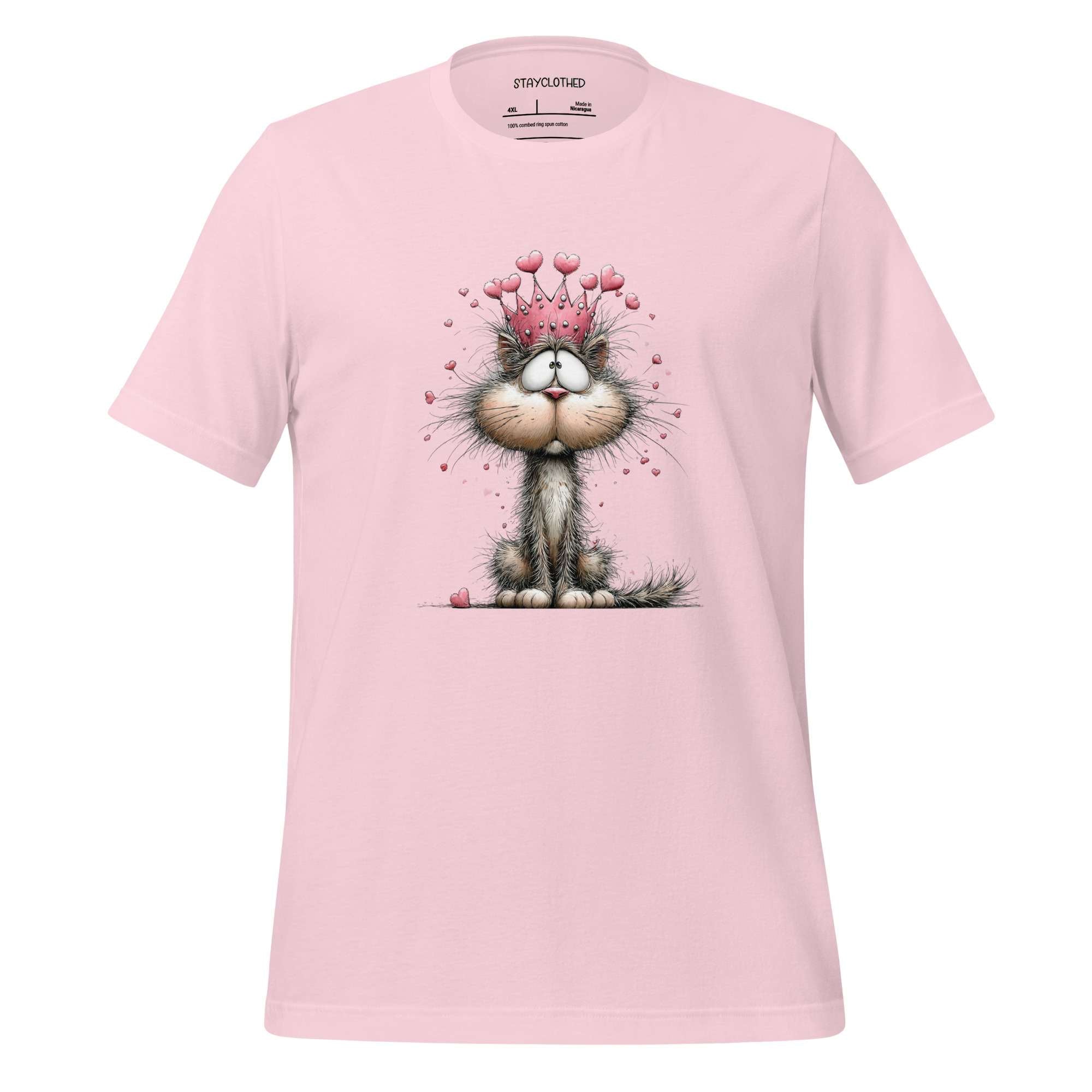 Pink t-shirt with a cat graphic on a wooden surface, featuring the brand 'StayClothed'.
