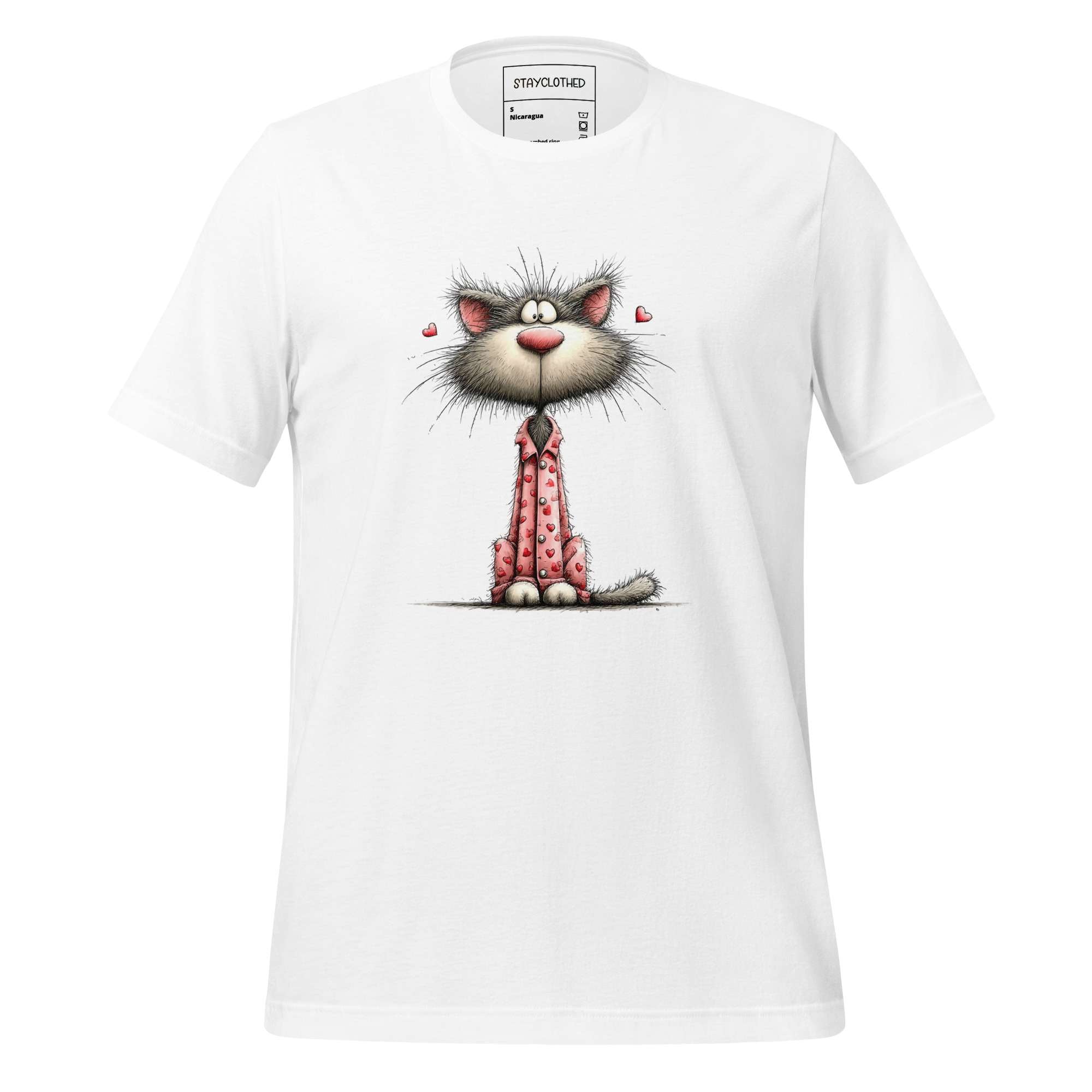 White t-shirt with a cartoon cat design on a wooden surface, featuring the brand 'StayClothed'.