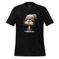 Black t-shirt with a cartoon cat wearing a hat on a wooden surface, featuring the brand 'StayClothed'.