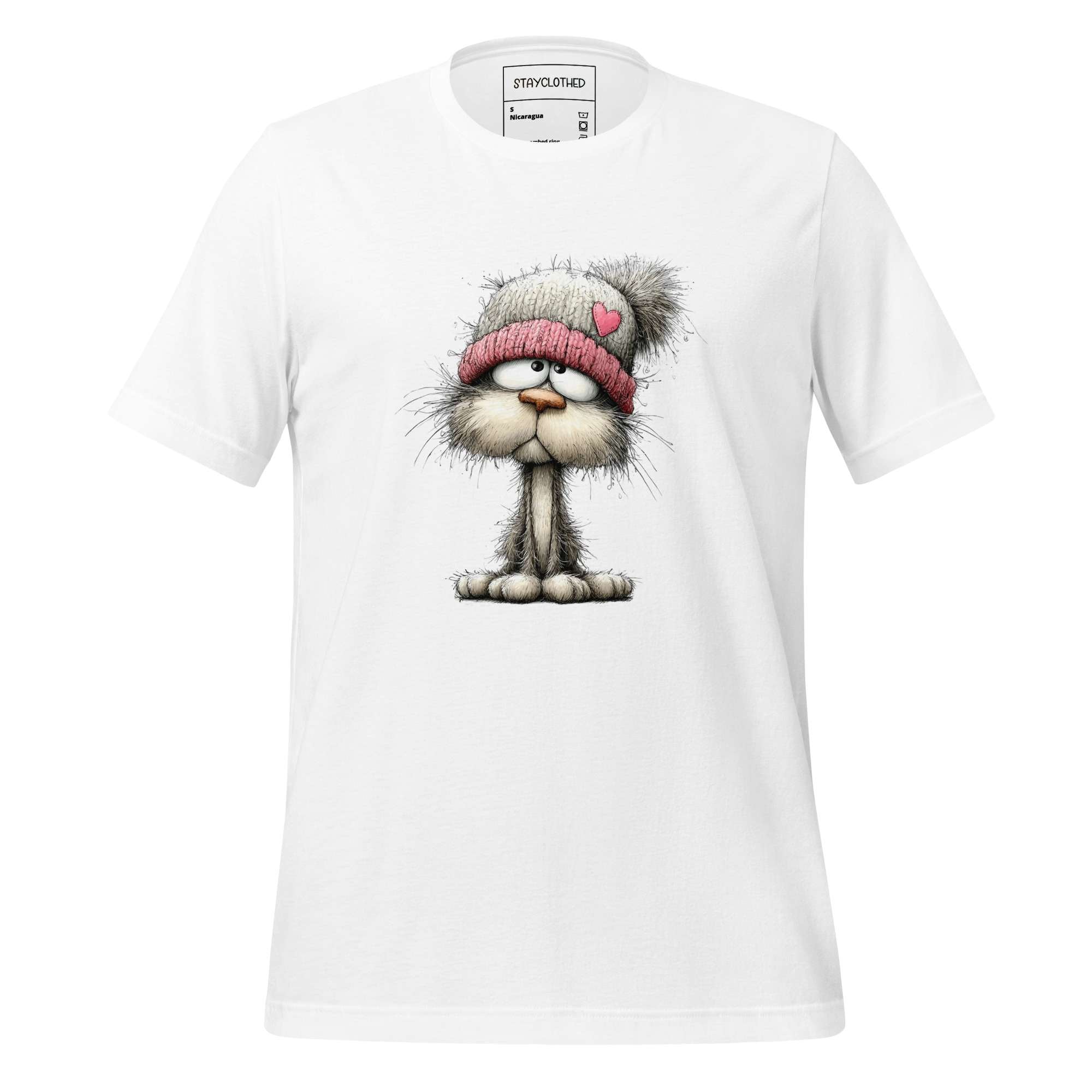 White t-shirt with a cat graphic and 'StayClothed' branding on a wooden surface.