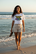 Model wearing the Weekend Vibes Loading Crop Top on a beach by the sea