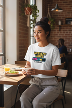 Model wearing the Weekend Vibes Loading Crop Top seated at a cafe table