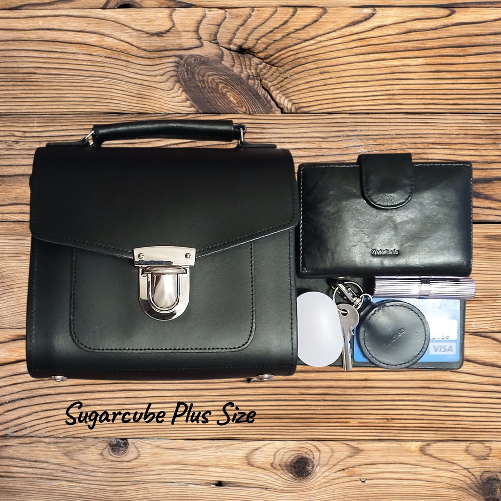 Black leather handbag and wallet set on a wooden surface with 'Sugarcube Plus Size' branding.