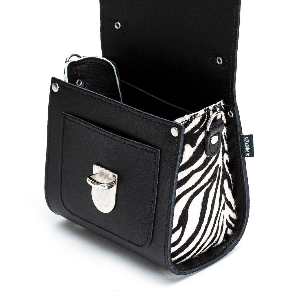 Black handbag with zebra pattern interior pocket on a white background