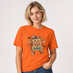 Trick Or Treat Bag Halloween t shirt in Orange worn by a studio model in an upper-body front relaxed pose on a clean white background