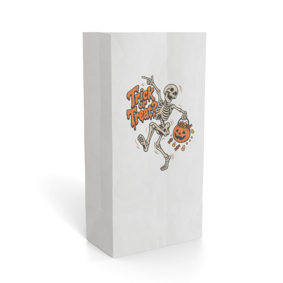 Front view of a paper gift bag with twisted handles, featuring “Trick or Treat?” lettering, a dancing skeleton, pumpkin and sweets.
