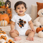 Baby wearing a white short sleeve bodysuit with a black cat in a witch hat holding a pumpkin bucket and “Trick or Treat?” artwork.