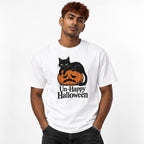 Front view of a white T-shirt featuring a black cat lying on a sad orange pumpkin with “Un-Happy Halloween” text.