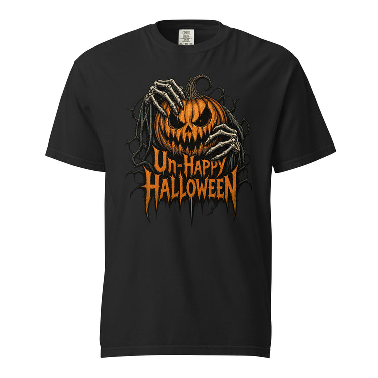 Black t shirt featuring A central orange jack-o’-lantern with an angry carved face is covered and held by skeletal hands, surrounded by twisted black vines. Distressed orange text below reads “Un-Happy Halloween”. The ar