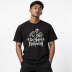 Model wearing a black T-shirt with “Un-Happy Halloween” Gothic lettering, a hooded skeleton, and grinning carved pumpkins.