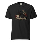 Front view of a black T-shirt featuring a black cat, skull, crescent moon, roses, lantern, and ornate “Stay Spooky” lettering.