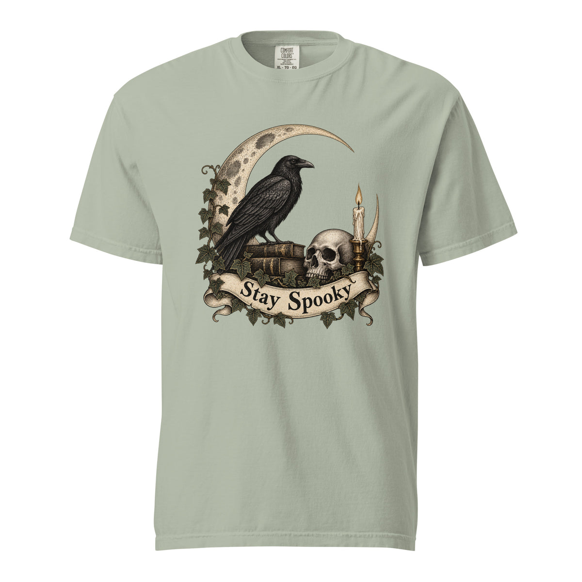 Bay T-shirt featuring a vintage gothic illustration of a raven on books, skull, crescent moon, candle and ivy, with “Stay Spooky” on a scroll