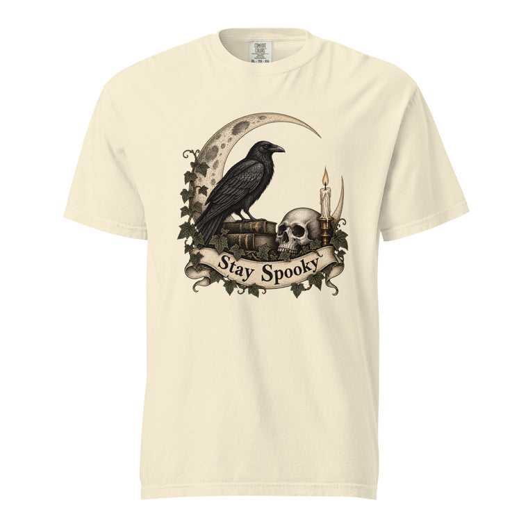 Ivory T-shirt featuring a vintage gothic illustration of a raven, skull, crescent moon, candle and ivy above “Stay Spooky” lettering.