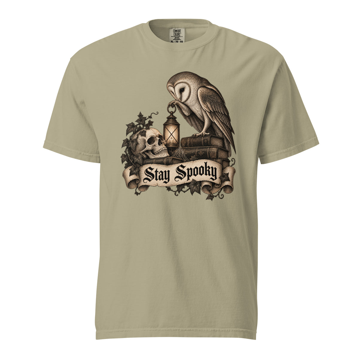 Khaki T-shirt featuring an owl, skull and lantern above a scroll reading “Stay Spooky” in gothic lettering
