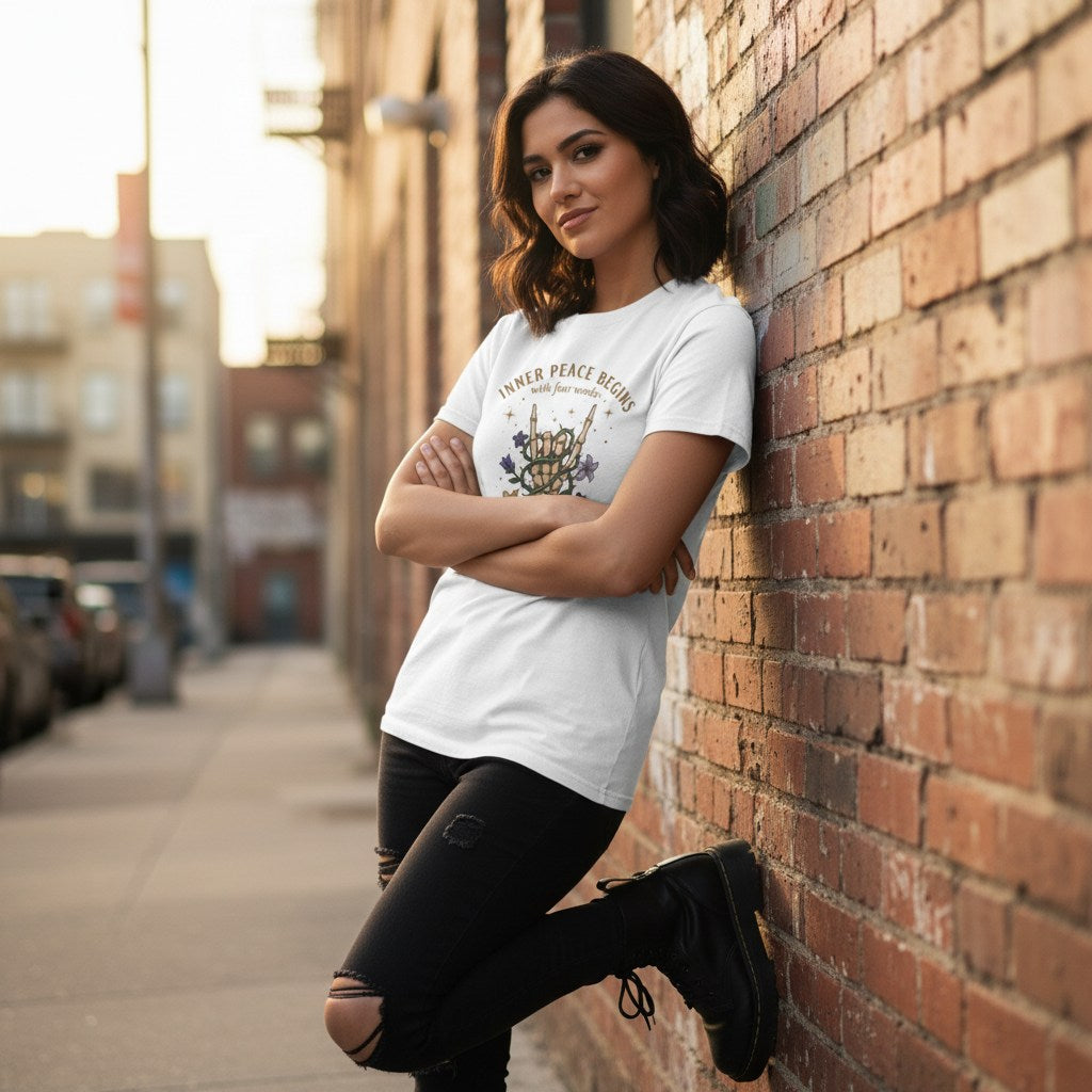 Urban fashion shot of a person in a white t-shirt walking along a city street.