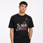 Well Shit Skeleton With Balloon t shirt in Black worn by a studio model in an upper-body front relaxed pose on a clean white background
