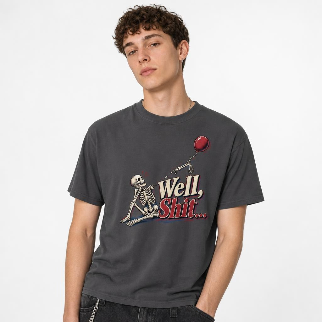 Well Shit Skeleton With Red Balloon t shirt in Graphite worn by a studio model in an upper-body three quarter left pose on a clean white background