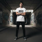 White man wearing a white t-shirt in a streetwear style photo.