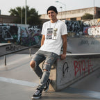 White man in a streetwear style photo wearing a white t-shirt.
