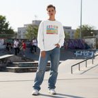 White non-binary person wearing a white autism awareness sweatshirt.