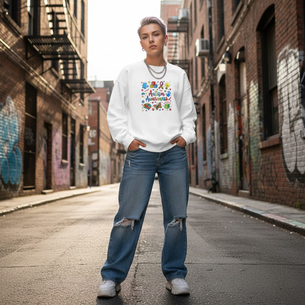 White non-binary person wearing a white autism awareness sweatshirt.