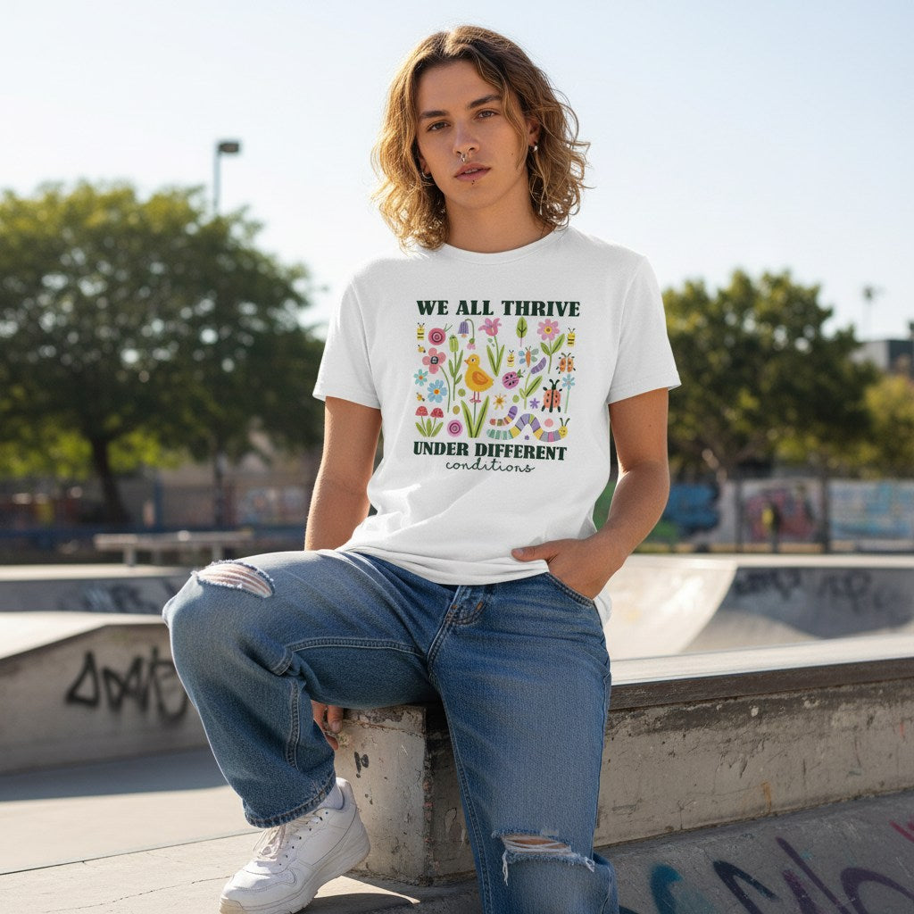 White non-binary person wearing a white neurodiversity t-shirt.