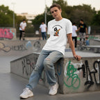 White non-binary person wearing a white You'll Never Walk Alone autism awareness t-shirt.