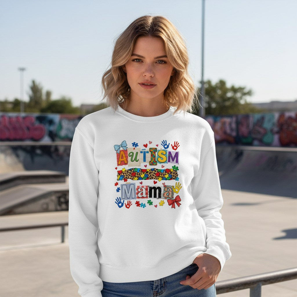 White woman wearing a white autism mama collage sweatshirt.
