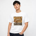 Model wearing a white T-shirt with a cartoon wooden spoon character and the words “WOODEN SPOON SURVIVOR.”