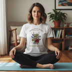 A man sitting cross-legged on a yoga mat in a bright, modern room, practicing meditation.