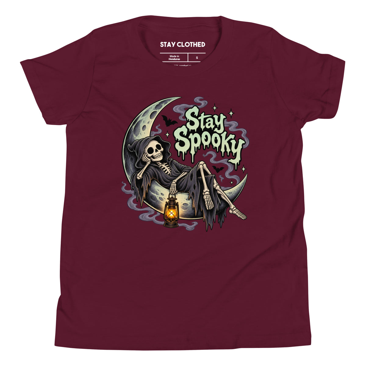 Maroon T-shirt featuring a hooded skeleton on a crescent moon with a lantern and “Stay Spooky” gothic lettering